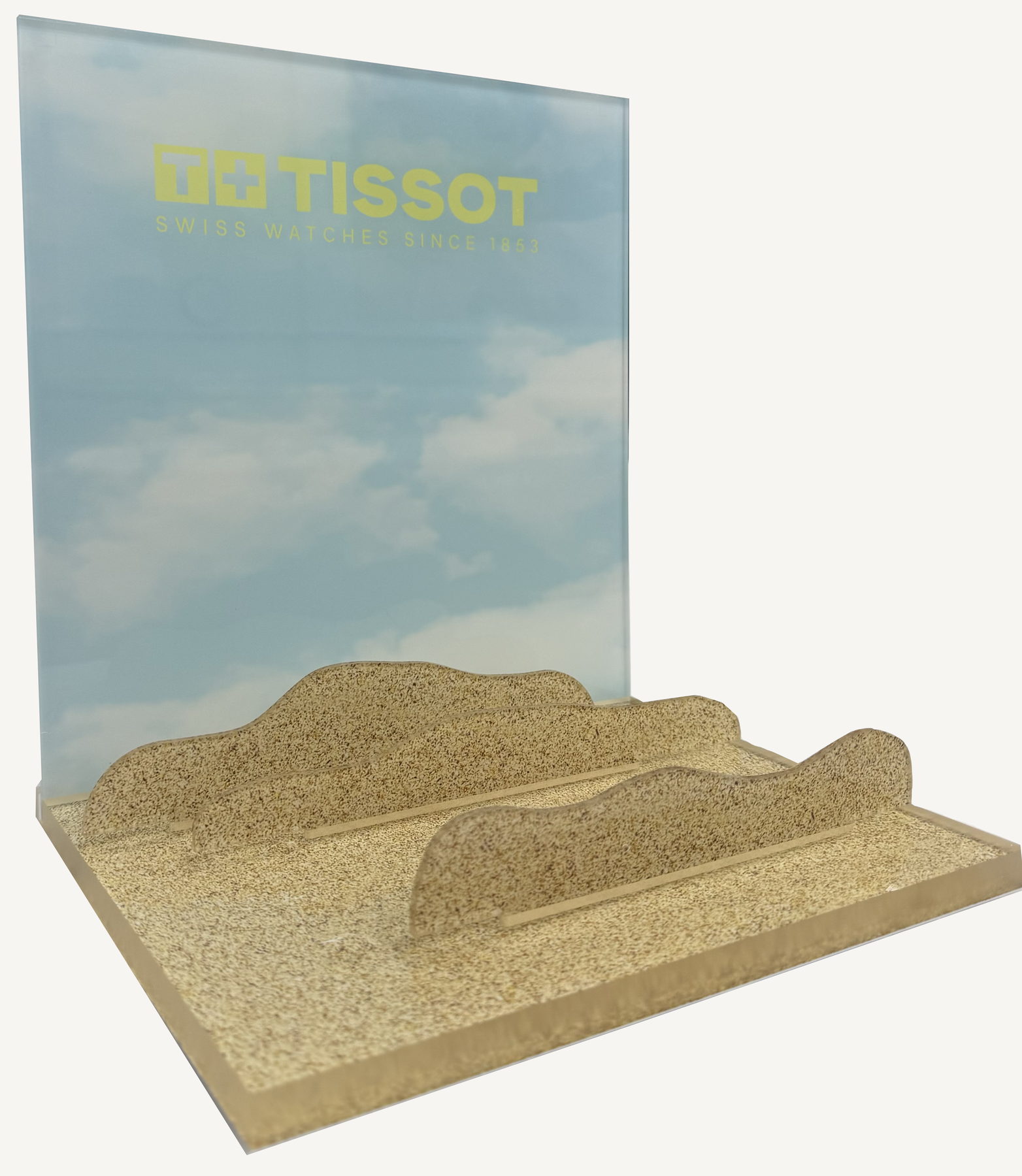 Tissot acrylic display with a pale blue panel and a textured base
